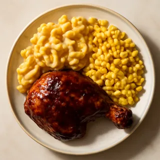 Barbecue Chicken Plate With Mac And Cheese And Buttered Corn