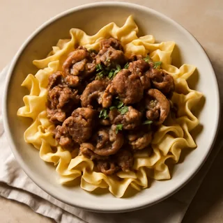 Beef Stroganoff Over Buttered Egg Noodles