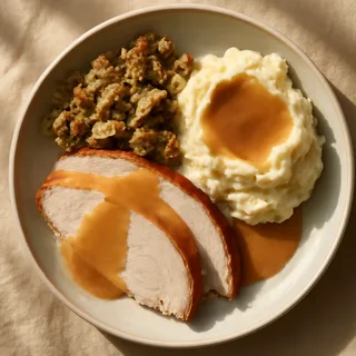 Carved Turkey Plate With Herb Stuffing Mashed Potatoes And Gravy