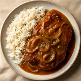 Smothered Pork Chops With Onion Gravy And White Rice